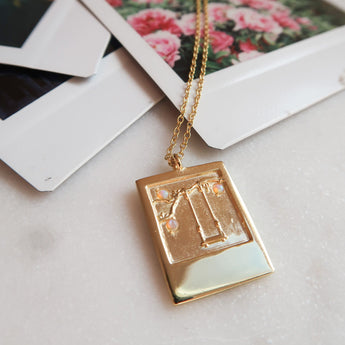 gold swing necklace