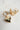 Gold heart-shaped earrings with a central gemstone